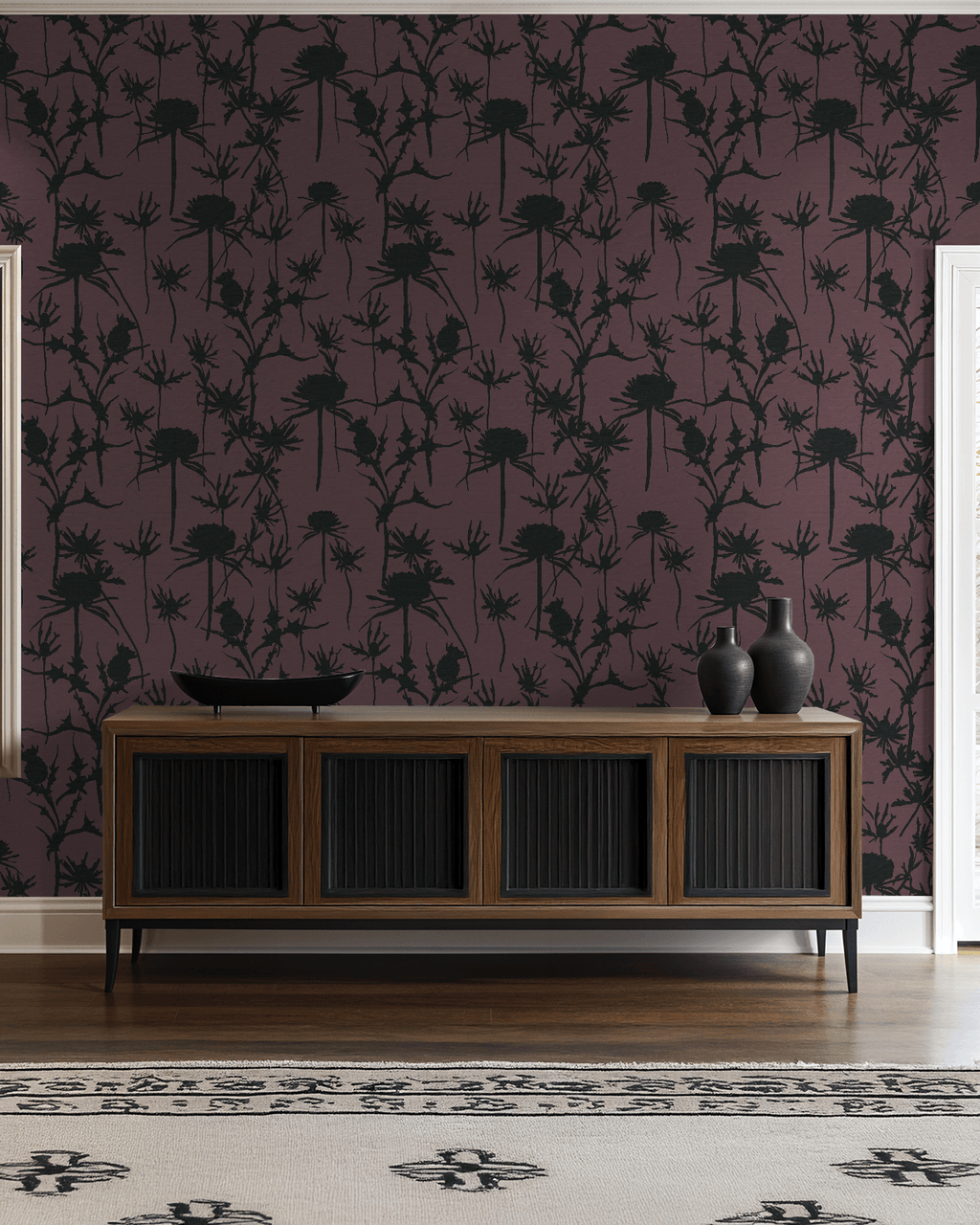 Living room with dark floral wallpaper, wooden console table, and decorative vases.