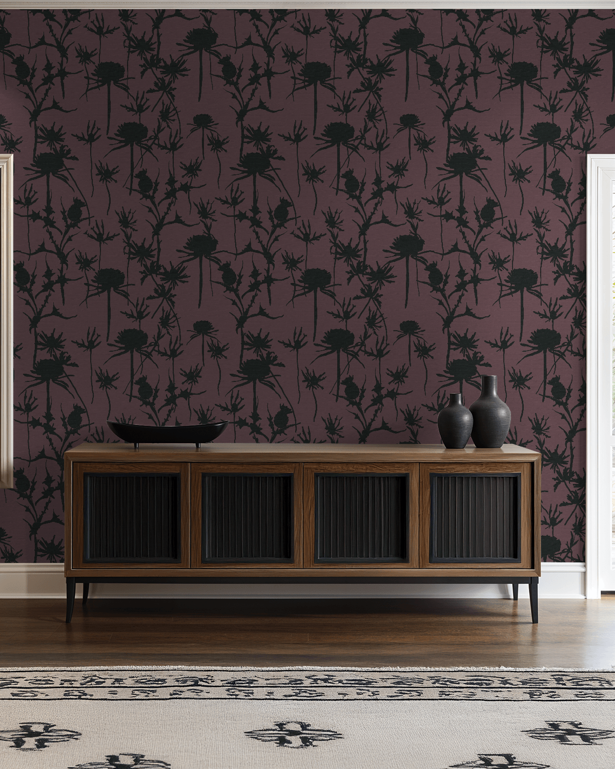 Living room with dark floral wallpaper, wooden console table, and decorative vases.