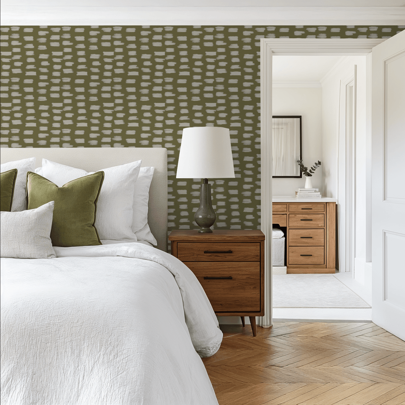 Modern bedroom with green patterned wallpaper, wooden nightstand, and bed with white and green pillows.